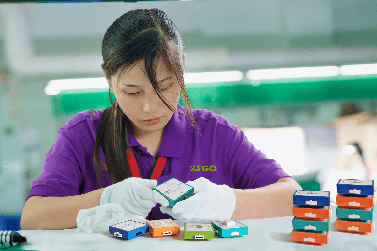 YSGO inspector at a workstation checking electronic building-block modules
